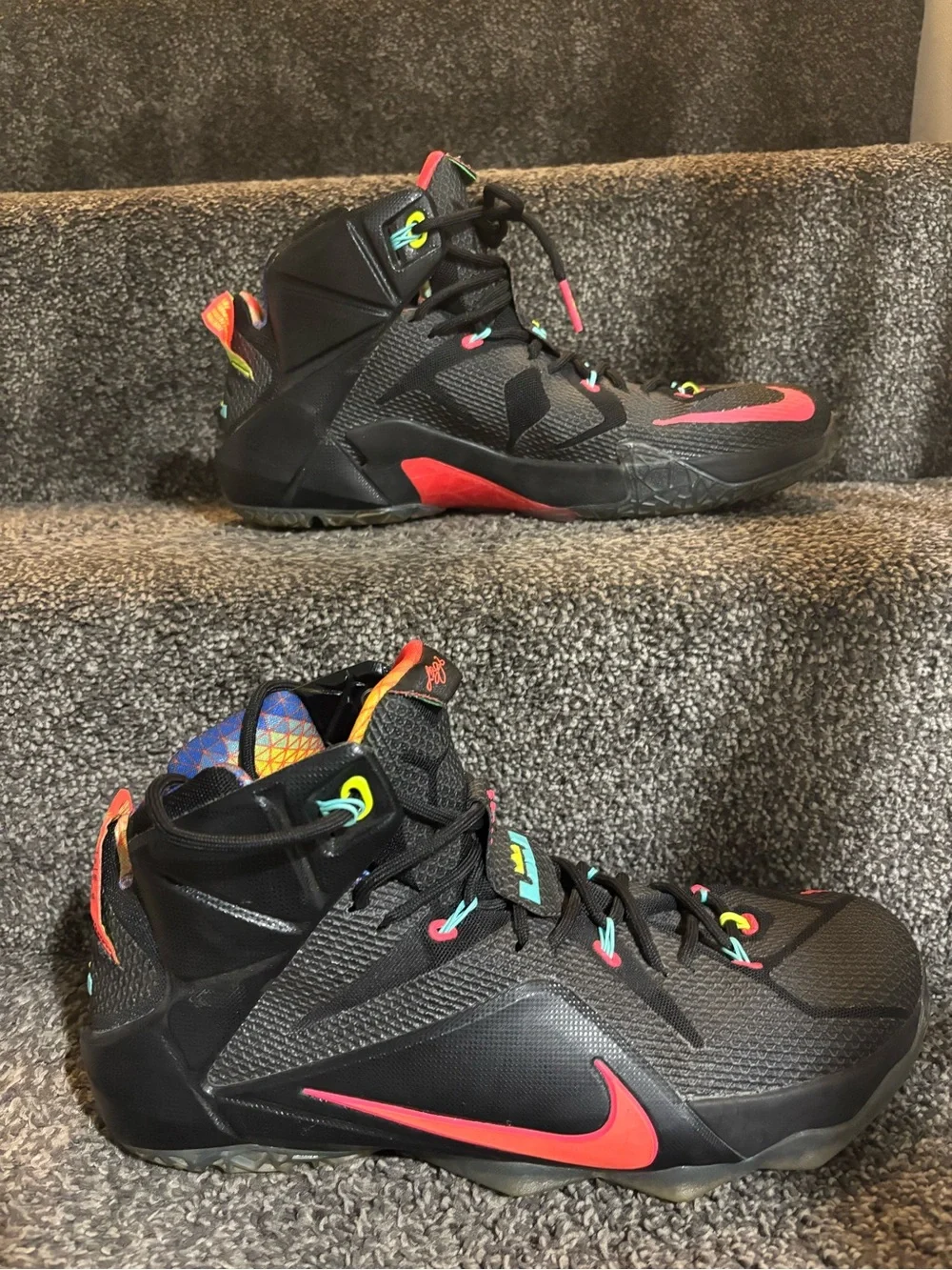 The Nike LeBron 12 Data Size 13 in black/orange colorway features icy bottoms,